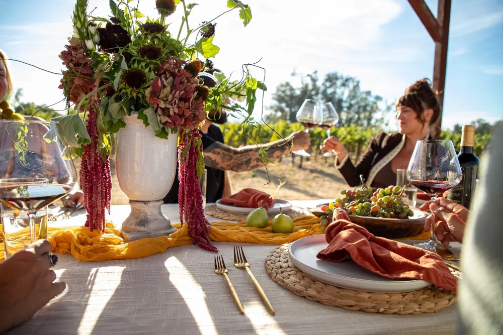 The urn centerpiece with guests behind.