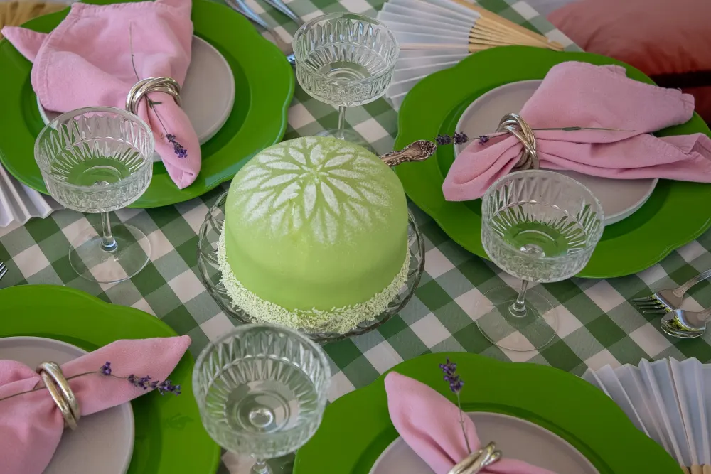 Green gingham, scalloped green plates, pink napkins and cut-glass coupes from above.